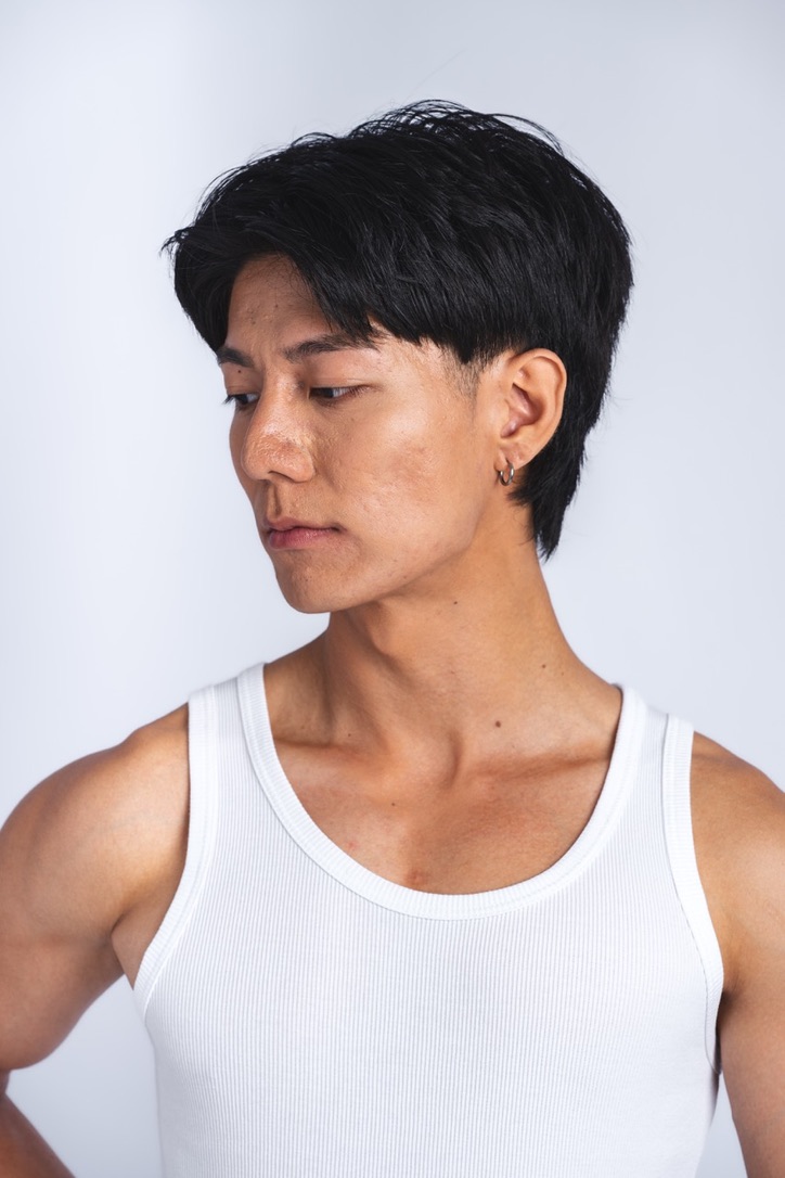 Studio portrait of Hongpo in a white tank top