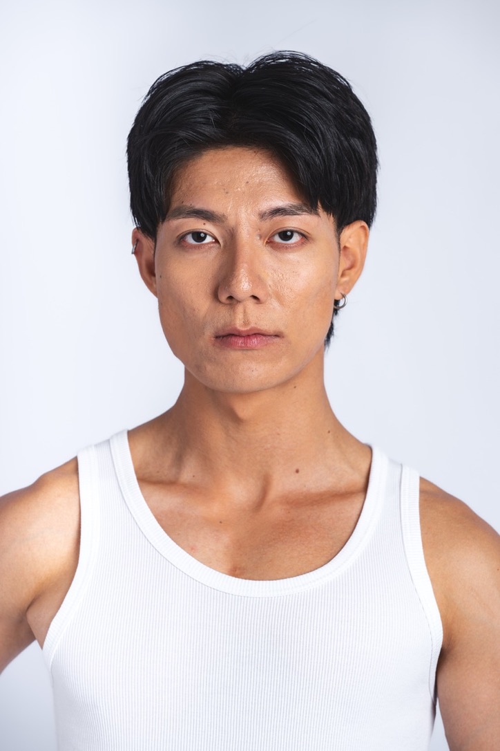 Profile portrait of Hongpo in a white tank top