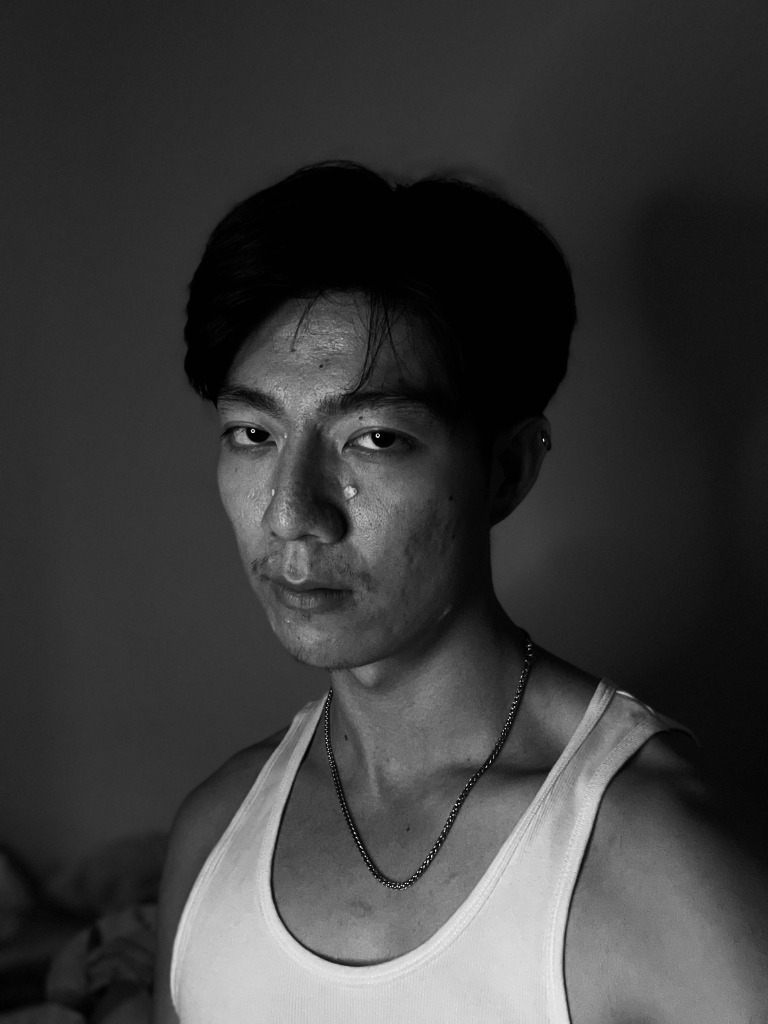 Black-and-white low-light portrait of Hongpo